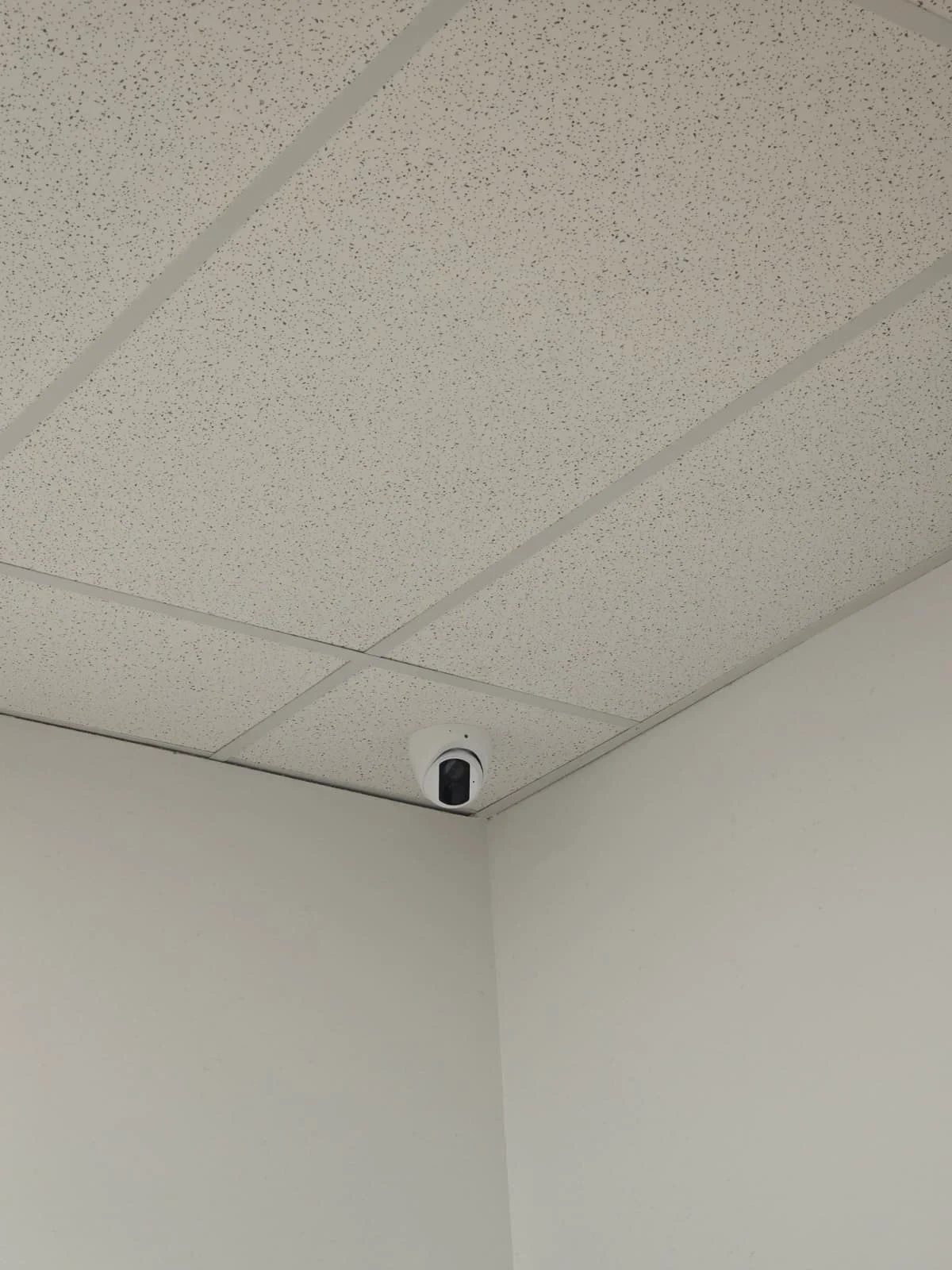 Security camera installed in a commercial drop ceiling