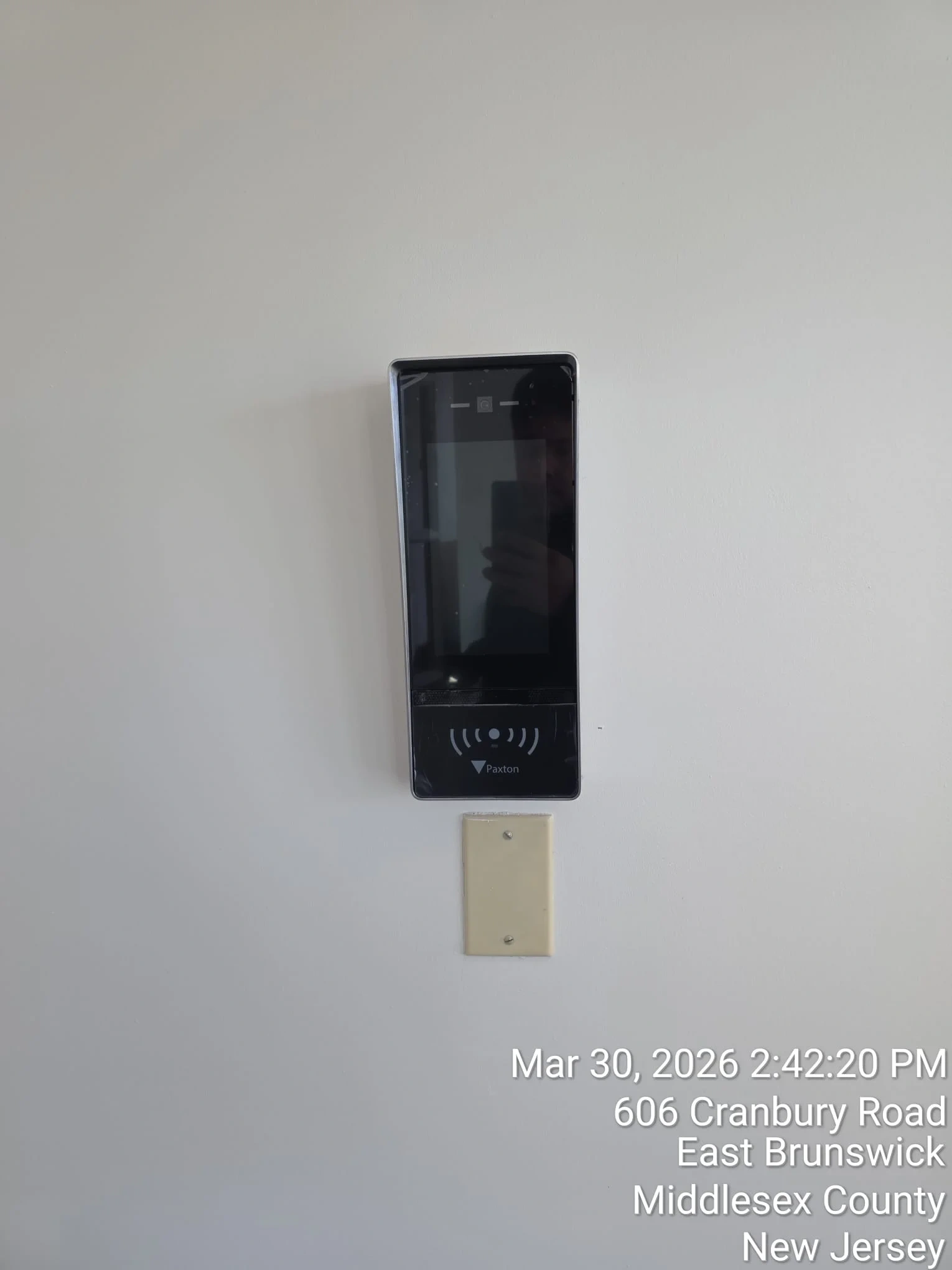 Wall-mounted access control panel installed for commercial building entry