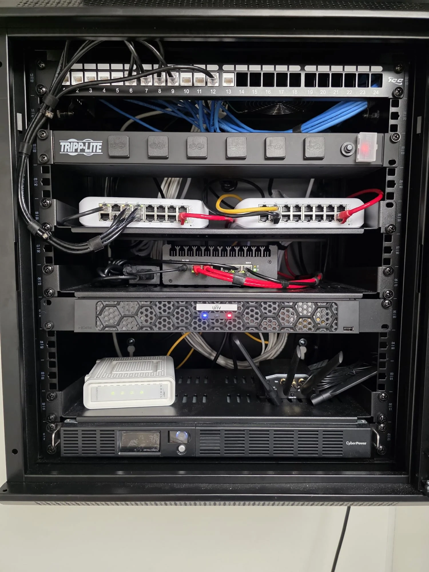 Wall-mounted network rack with organized low-voltage cabling